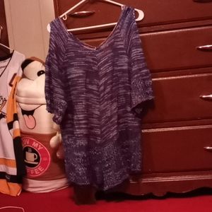 Peek-a-boo shoulder shirt.